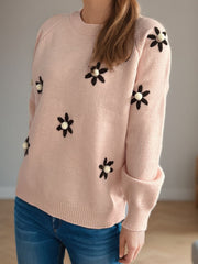 Apricot knit sweater with embroidered floral details and beaded centers.