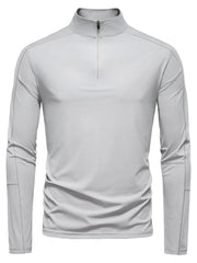 Gray performance zip-neck tee with structured shoulders and long sleeves.