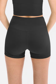 Black ribbed sculpting active shorts with high waist and v-seam detail.