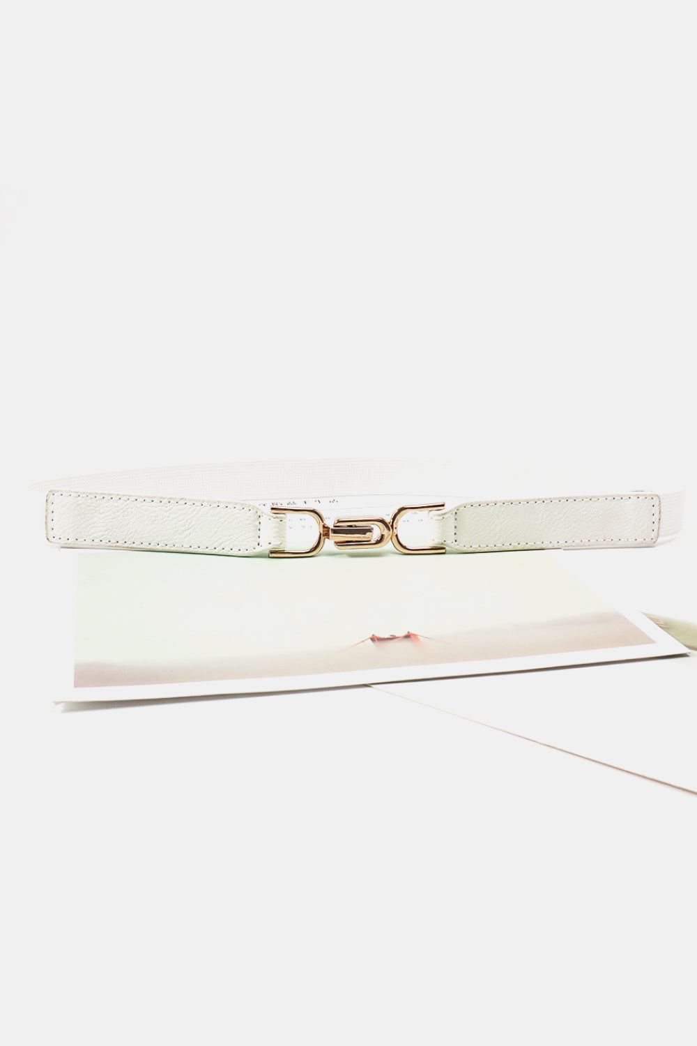 White elasticated hook-clasp waist belt with gold-tone buckle detail