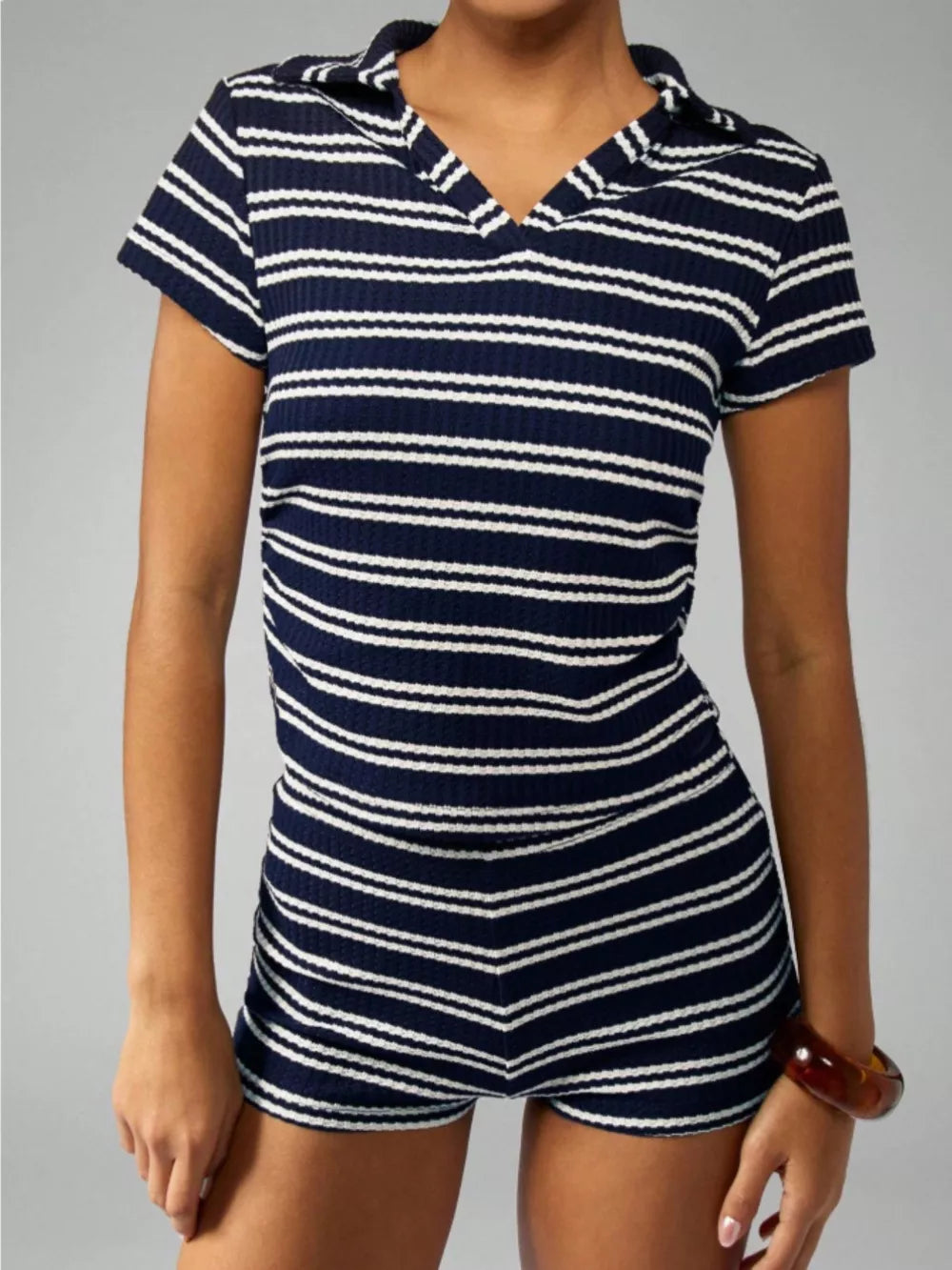 Chic striped knit two-piece set with polo collar and short sleeves in blue stripes.