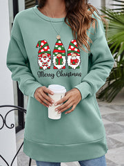 Sage green tunic sweatshirt with Christmas gnomes graphic and Merry Christmas text.