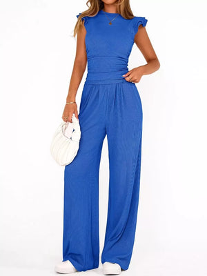 Sky blue ruffled cap sleeve maternity jumpsuit with crew neck and wide leg pants.