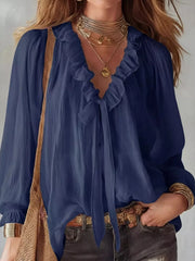 Navy frilled tie-front shirt with long sleeves and a V-neckline.