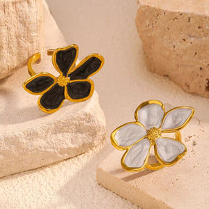 Gold open ring with black and cream floral design