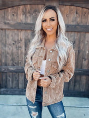Tan corduroy jacket with studded details and western-inspired styling.