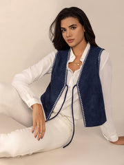 Dark blue suede-effect vest with contrast stitch trim and tie closure.
