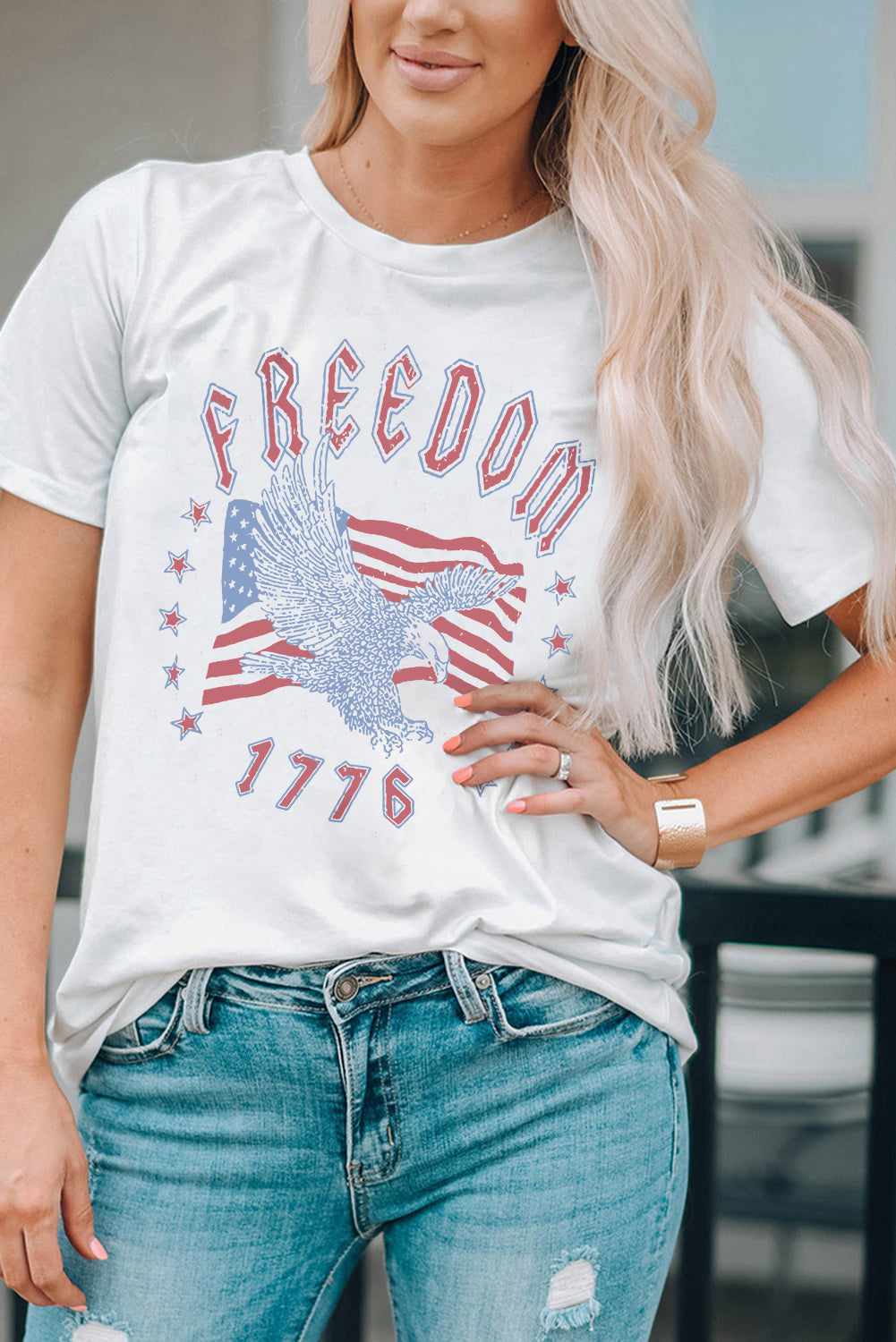 White graphic tee with eagle, American flag, and 1776 print
