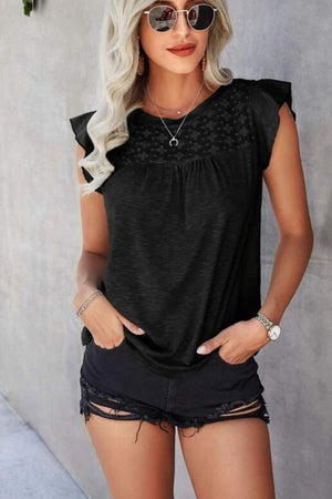 Black cotton eyelet yoke flutter sleeve top with a scoop neckline.