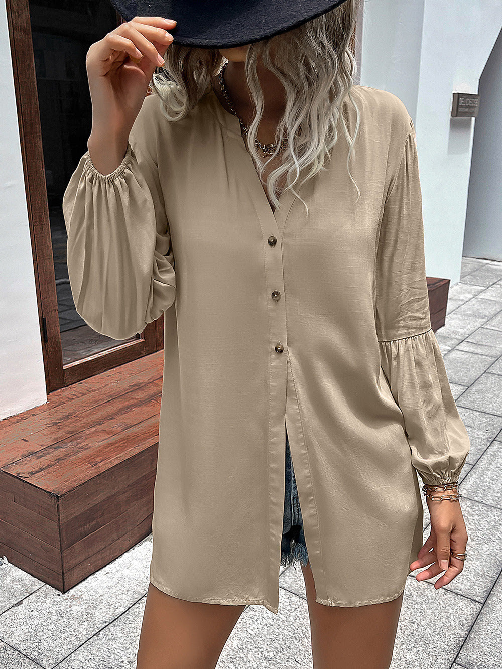Khaki oversized blouse with mandarin collar, button front, and balloon sleeves.