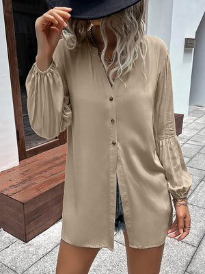 Khaki oversized blouse with mandarin collar, button front, and balloon sleeves.