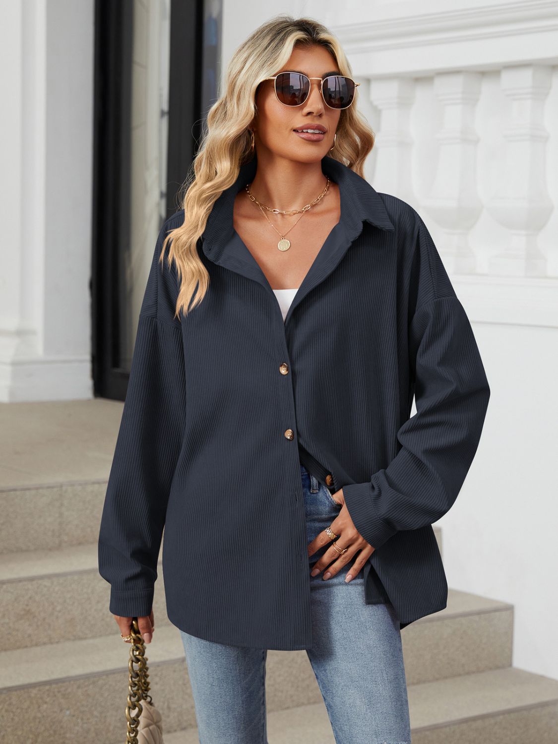 Oversized corduroy shirt jacket in Dark Navy with button front and collar.