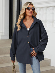 Oversized corduroy shirt jacket in Dark Navy with button front and collar.