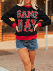 Black sweatshirt with red GAME DAY varsity graphic and red trim