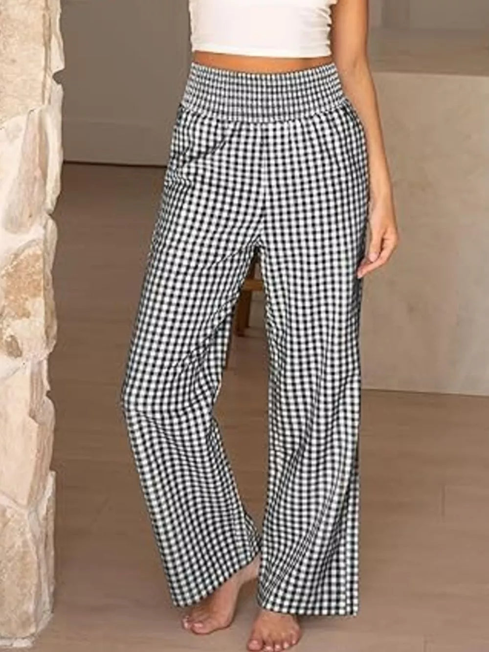 Black plaid gingham maternity pants with smocked waistband and wide legs.