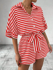 Red and white striped shirt romper with button front and self-tie belt.