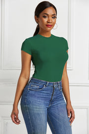 Dark green crew neck bodysuit with short sleeves, styled with blue jeans.