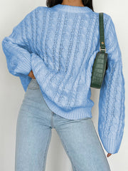 Sky blue cable knit openwork sweater with crew neck and long sleeves.