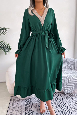 Forest green midi dress with lace trim V-neck, tie waist, and ruffled hem.
