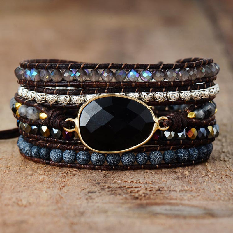 Black gemstone and bead wrap bracelet with leather cords and alloy accents.