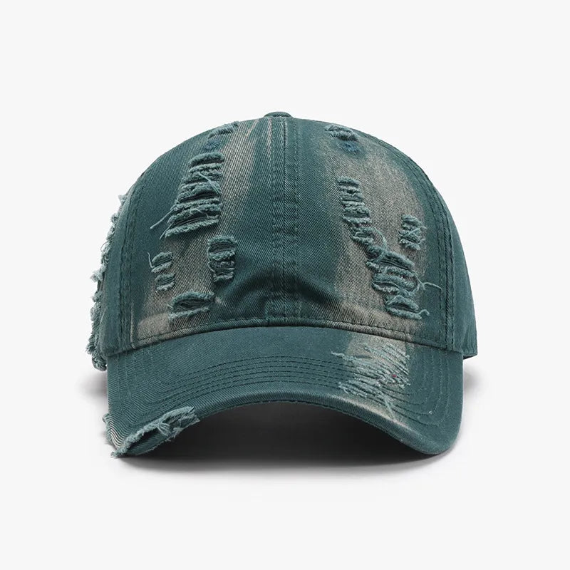 Distressed dark green canvas baseball cap with ripped details.
