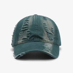Distressed dark green canvas baseball cap with ripped details.