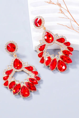 Red crystal drop earrings with floral-inspired design and gold-tone alloy setting.