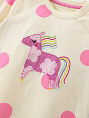 Cream cotton pajama top with pink polka dots and a pink unicorn applique.