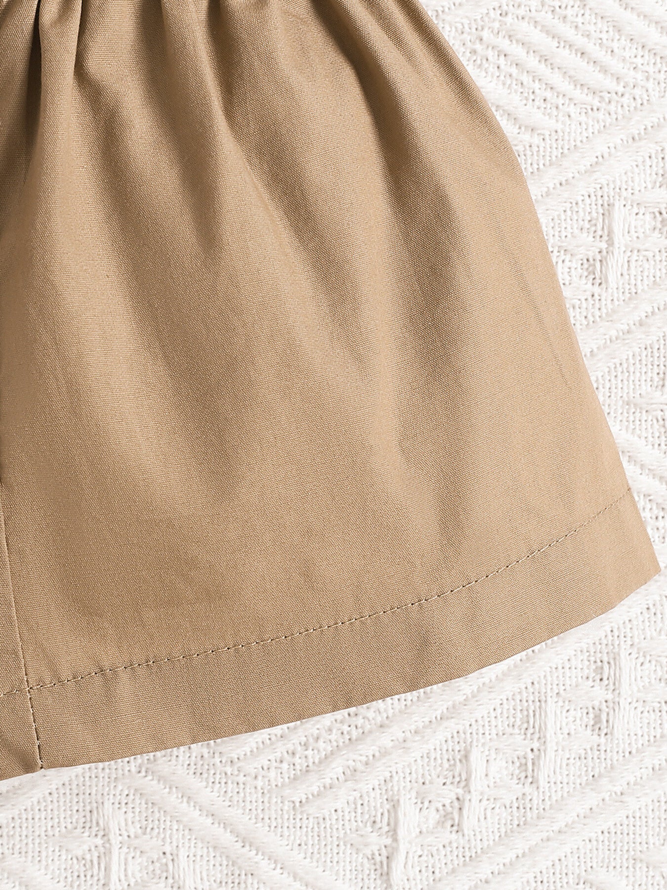 Baby girl's camel bow top and shorts set with leaf print detail.