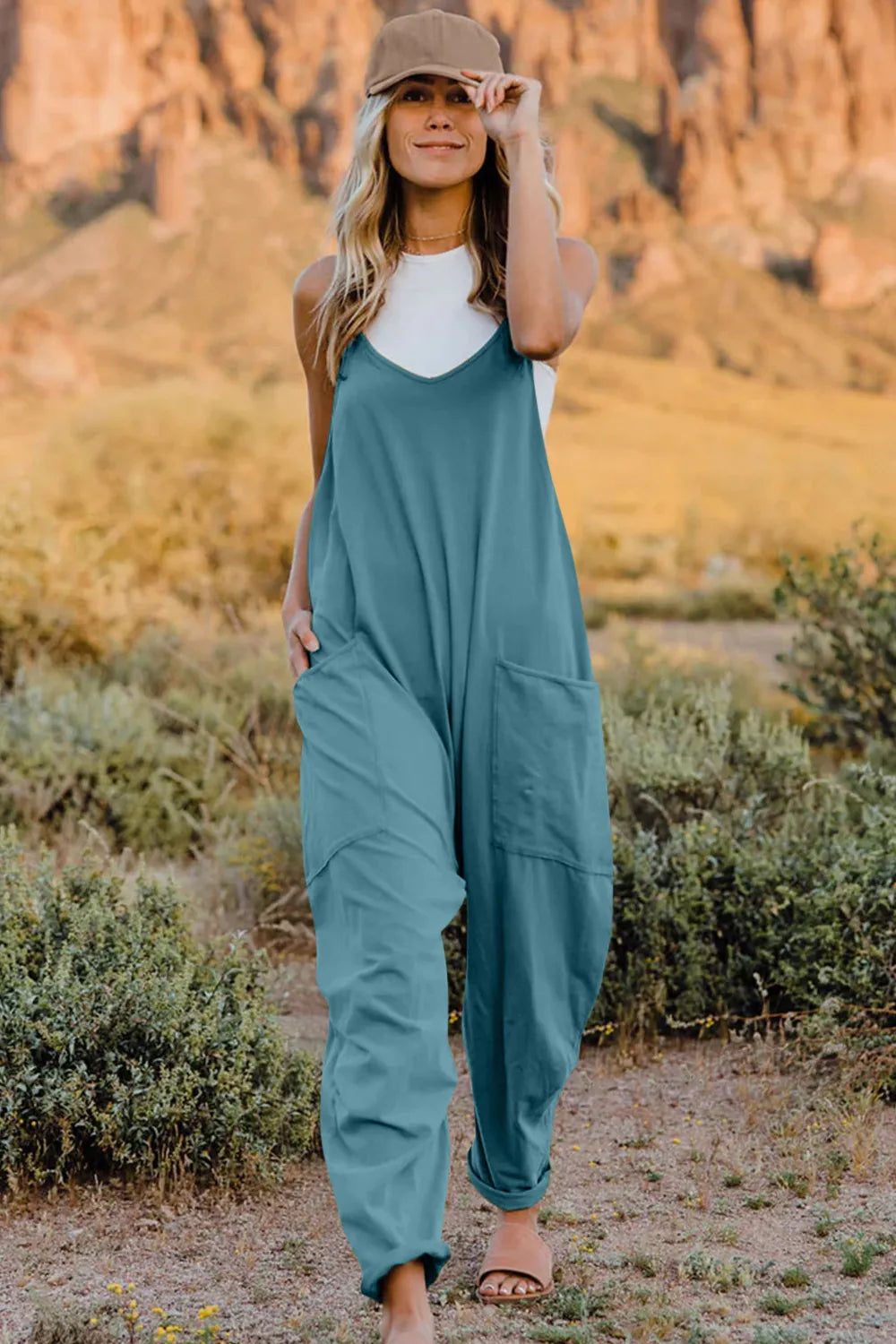 French blue cotton V-neck wide-leg jumpsuit with pockets and a relaxed fit.