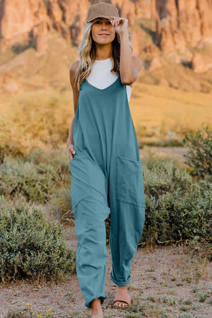 French blue cotton V-neck wide-leg jumpsuit with pockets and a relaxed fit.