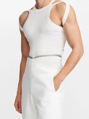 White sculpted shoulder strap tank top with cutouts and a round neckline.