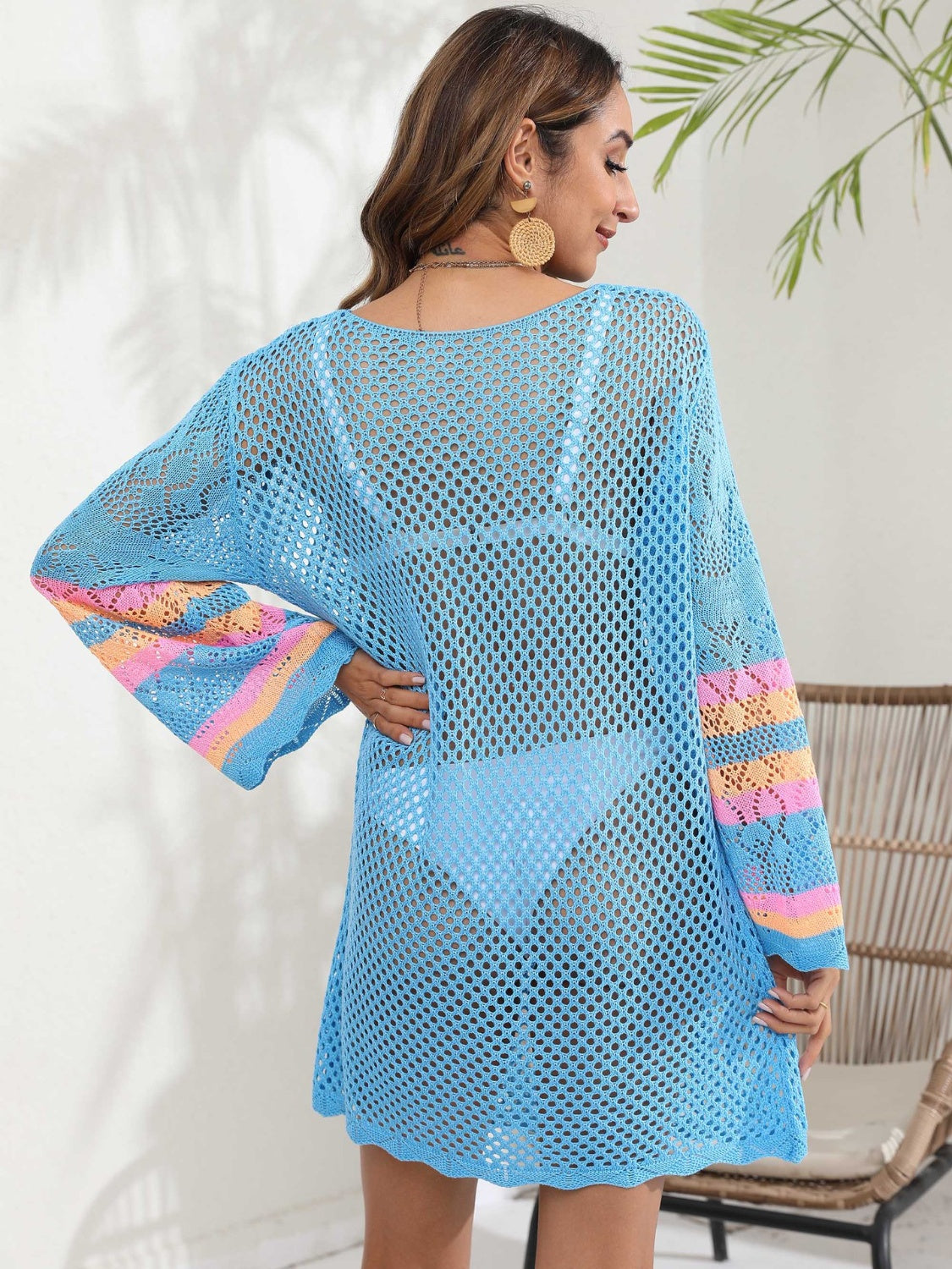 Light blue crochet cover-up with striped bell sleeves and a scoop neck.
