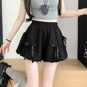 Black bubble skirt with high waist and bowknot details.