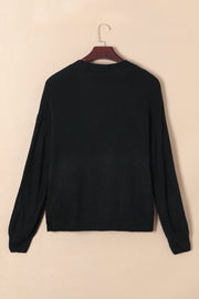 Black acrylic knit cardigan with textured pattern and crew neck