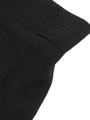 Black sleeveless top and pants set detail showing fabric texture and seam.