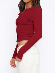 Burgundy ribbed button-down crop top with long sleeves