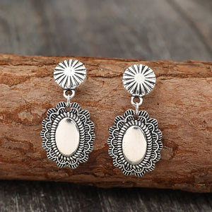 Antique silver scalloped oval drop earrings with sunburst studs.