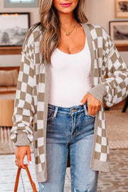 Checkerboard knit cardigan with ribbed details and button-down front, styled with a white tank and jeans.