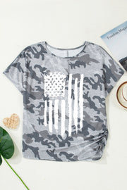 Grey camouflage crew neck t-shirt with distressed American flag graphic and ruched side detail.