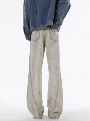 Men's beige wide leg jeans with distressed wash and visible stitching detail