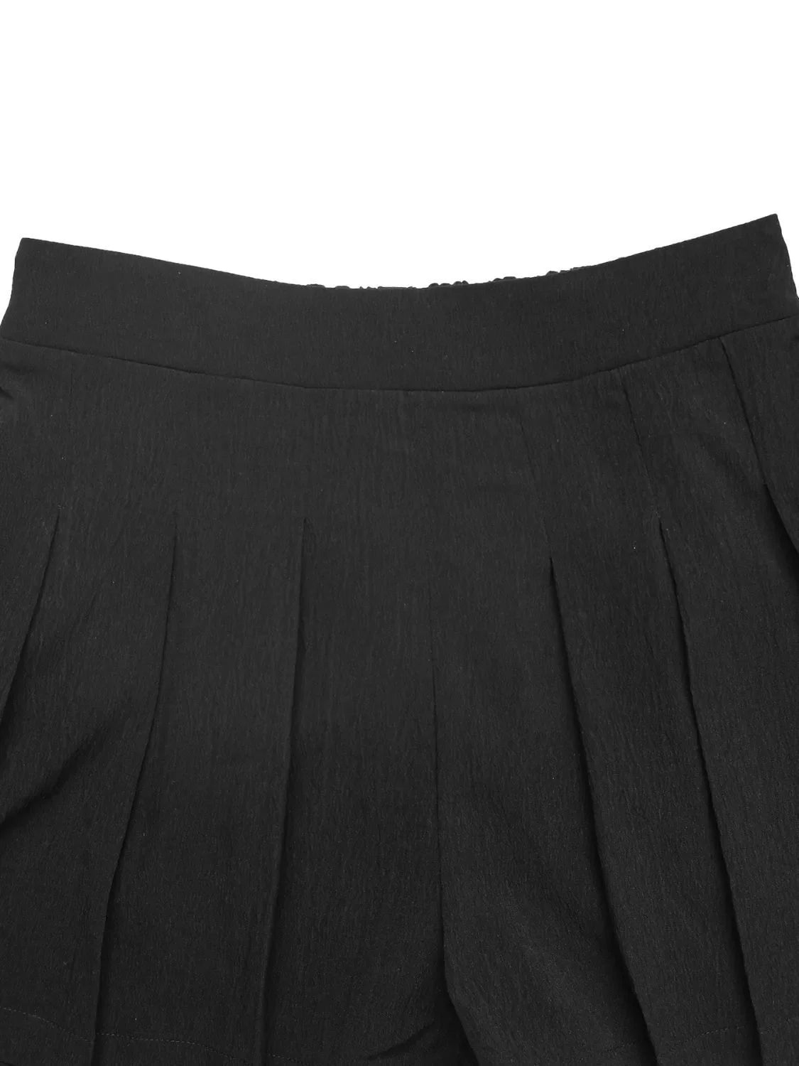 Black pleated shorts with a comfortable elastic waistband and textured fabric.