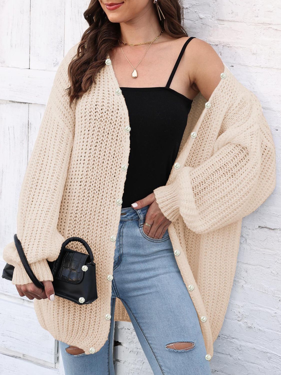Pearl button balloon sleeve cardigan in tan with open knit detail.