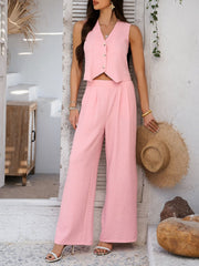 Blush pink textured crop vest and wide leg pants set with button detail.
