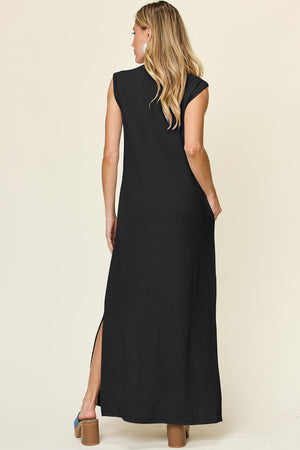Black ribbed maxi dress with side slits and pockets, sleeveless, mock neck