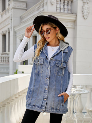 Hooded denim vest in dusty blue with button-down closure and drawstring hood.
