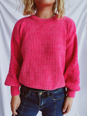 Textured ribbed knit crewneck pullover sweater in bright pink with balloon sleeves.