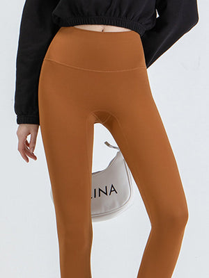 Caramel high-waist leggings with a smooth finish.