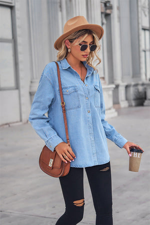 Light wash oversized denim shirt with patch pockets, collared neck, and buttoned front.