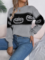 Gray acrylic knit sweater with black jack-o'-lantern intarsia pattern, crew neck, and balloon sleeves.